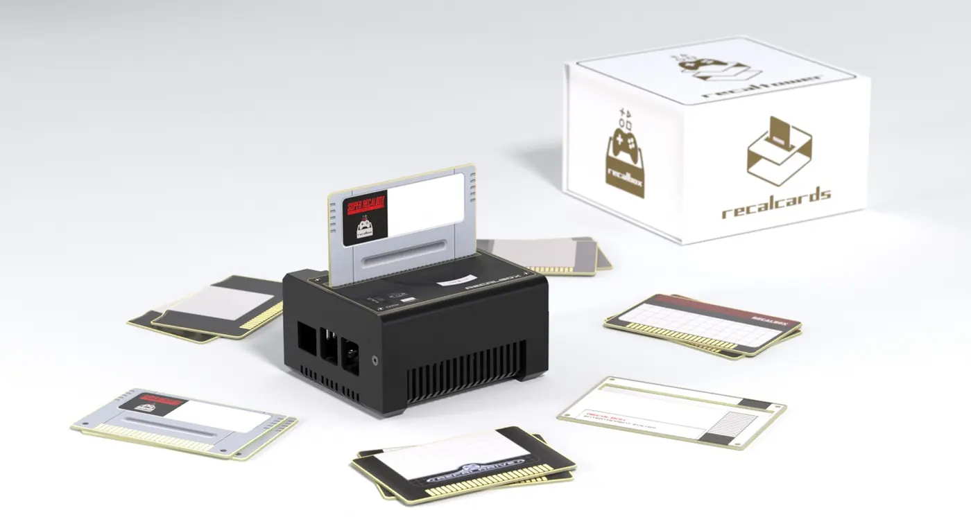 A RecalTower topped with the Card Reader, a RecalCard inserted, beside its box